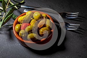 Clay pot with artisan olives.