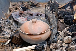 Clay pot on coals