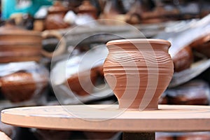 Clay pot during its manufacture on potter`s wheel