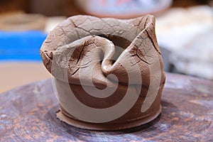 Clay pot on a pottery wheel