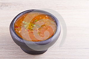 Clay pot with spicy sauce, typical colombia food photo