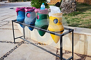 Clay pots of blue,  yellow and green colors