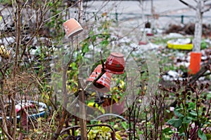 Clay pots on the fence.winter garden farm decoration