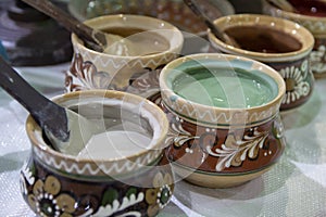 Clay pots are handmade with colorful paint