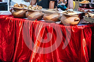 Clay pots with traditional Peruvian food photo