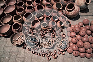 Clay pots of various sizes for sale at a market