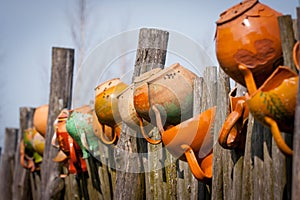 Clay pots on the wooden fence