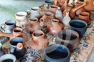 Clay pottery ceramics. Many different pottery standing in a potery workshop.