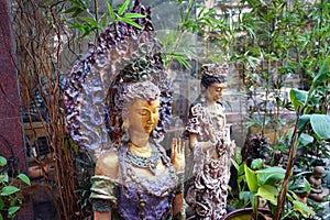 Clay sculptures of girls in the garden