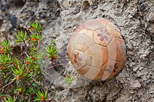 Clay soccer ball at the wall of the Door of the History in the small beautiful town of Mongui photo