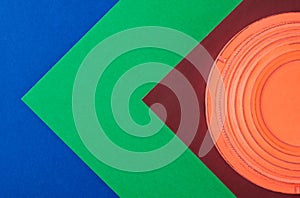 Clay target for skeet shooting against the colorful geometric background