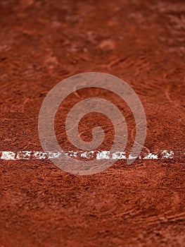Clay tennis court with footprints