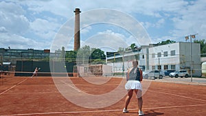 On the clay tennis court ladies preparing for tennis championship training together outdoor concept of healthy lifestyle