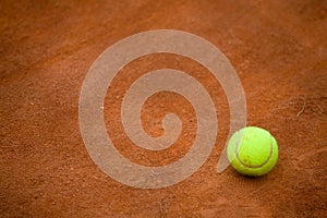 Clay tennis court and tennisball