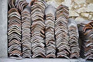 Clay tiles are stacked in rows. roof repair. south of russia, summer