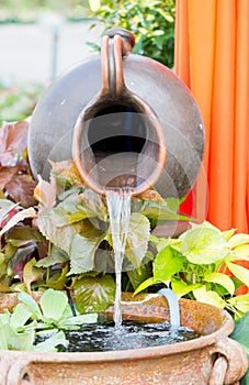 Clay Water Feature With Pond. photo