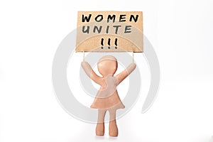 clay woman figurine holding women unite protest banner