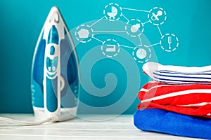 Clean baby clothes and iron. Laundry. Concept of newborns, motherhood, care, lifestyle