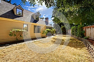 Clean backyard area with dry grass