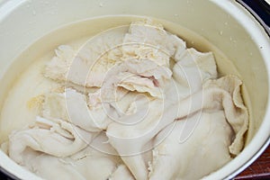 Clean beef tripe ready for cooking in a pot. Cow raw stomach intestines texture for cooking