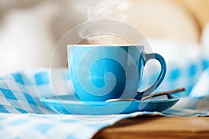 A clean blue cup in the kitchen. Mockup. Selective focus. Mock-up of a tea mug.