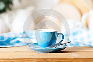 A clean blue cup in the kitchen. Mockup. Selective focus. Mock-up of a tea mug.