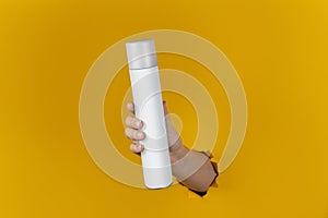 Clean Bottle Spray Flacon in the Hand. Cosmetic or Perfume Advertisement. Ready to use. Dry Shampoo. Photo for design