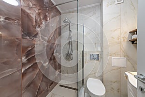 Clean bright stylish designer modern bathroom. Bathroom interior in luxury home with glass shower