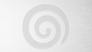 Clean bright white textured background with subtle light and shadow creating a soft diffused luminous effect