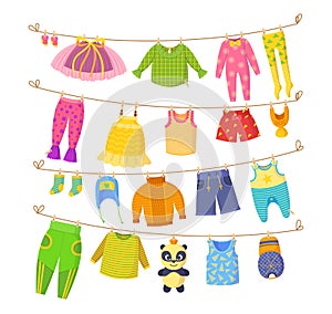 Clean child small clothes, cloth rope, kids dry clothing on clothesline