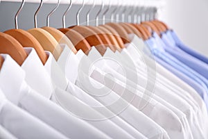 Clean clothes on hangers after dry-cleaning