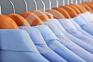 Clean clothes on hangers after dry-cleaning