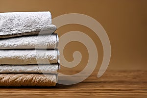 Clean colorful folded towel nice and tidy stack each other and some negative space for fitness, bath, swimming, massage and spa