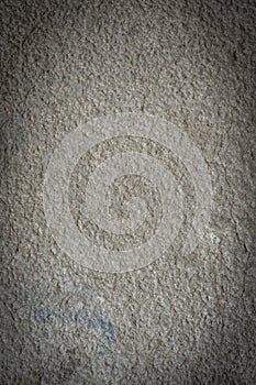 Clean concrete wall with small blue mark for texture or background