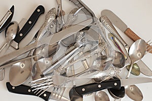 Clean cooking utensils for daily use, empty dishes on a white table background