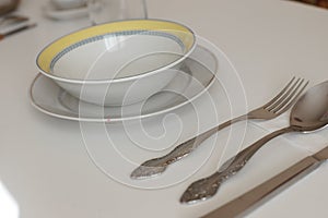 Clean cooking utensils for daily use, empty dishes on a white table background