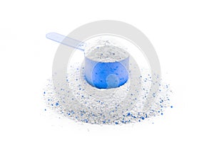 Clean detergent. Wash powder texture in cup or scoop for washing machine isolated on white. Liquid soap laundry background. Eco