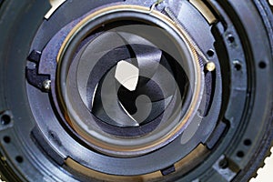 Clean and disassemble the lens for photography into its component parts
