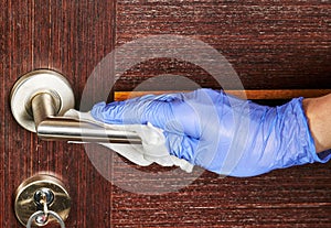 Clean and disinfect door handle. Germs, bacteria, Covid-19 Contamination