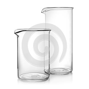 Clean empty glass beakers on background