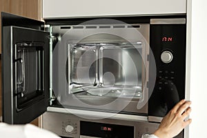 Clean, empty microwave inside view.