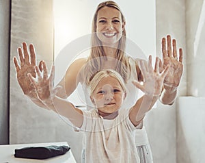 Clean family, smile and washing hands in bathroom, hygiene and sanitary with soap foam. Happy woman and child, portrait