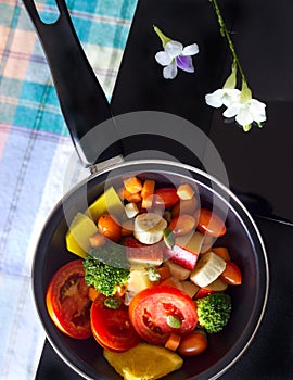 Clean food, mix fruit and herb in pan on dark background, Top view