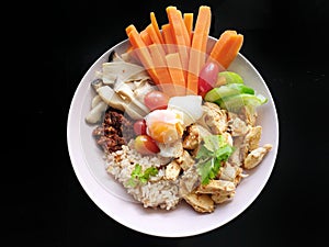 Clean food style, Top view of grilled chicken, boiled egg and vegetable salad with carrot, lettuce, tomato and spicy seafood dippi