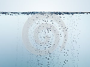 Clean fresh water with hundreds of air bubbles photo