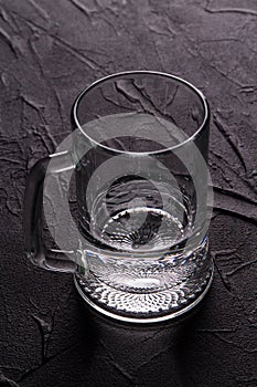 Clean glass mug with transparent liquid.