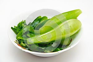 Clean green cucumbers on a plate. Vegetarian healthy food