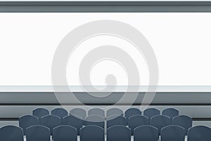Clean grey auditorium with seating and empty screen with mock up place for your advertisement. Show premiere and entertainment