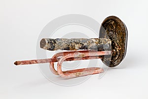 Clean heating element for heating water in domestic water heaters and boilers on white background. Copy space and close up