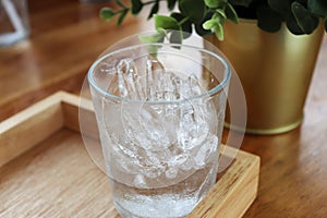 Clean ice in the glass Drink for a thirst for summer  placed on a wooden tray close-up